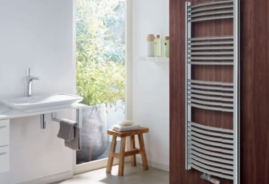bathroom with stair radiator, brown wall