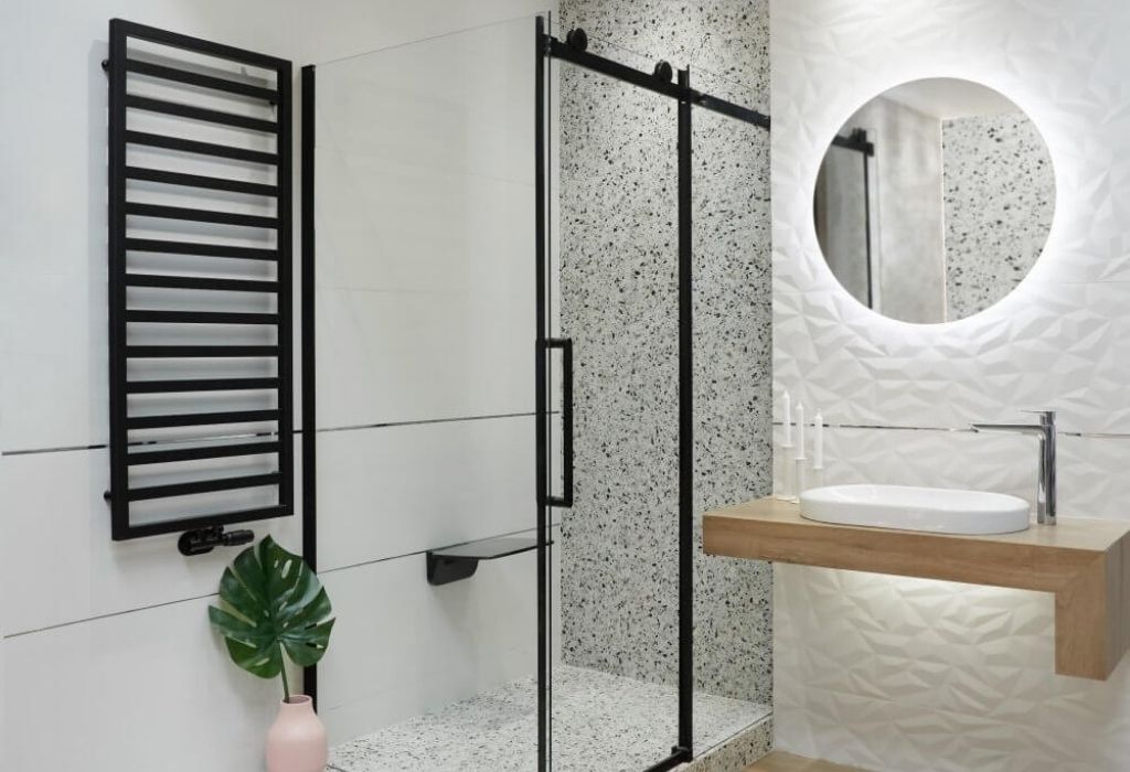 white bathroom with black radiator